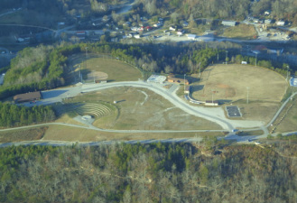 Arial View of the Happy Top Park in Beattyville, KY. Amphitheater, baseball field, softball field, splash park, walking trail, community building.